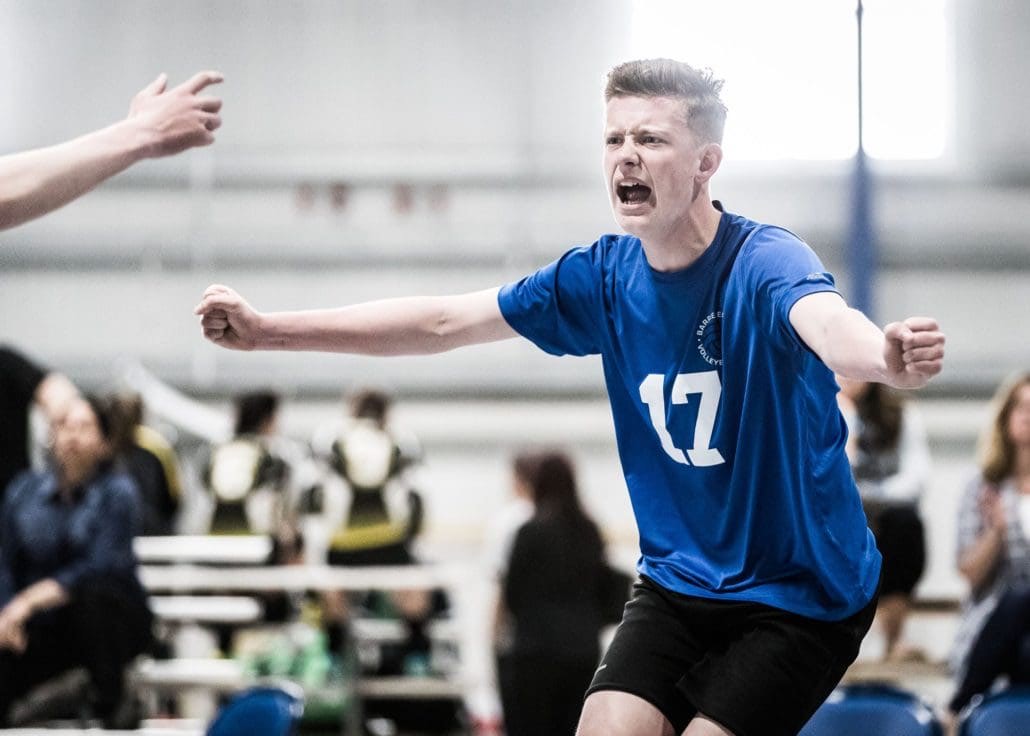 WATERLOO, ON - MAY 7, 2017: Players from the Barrie Elites Volleyball Club celebrate a kill at the U15 East Nationals.